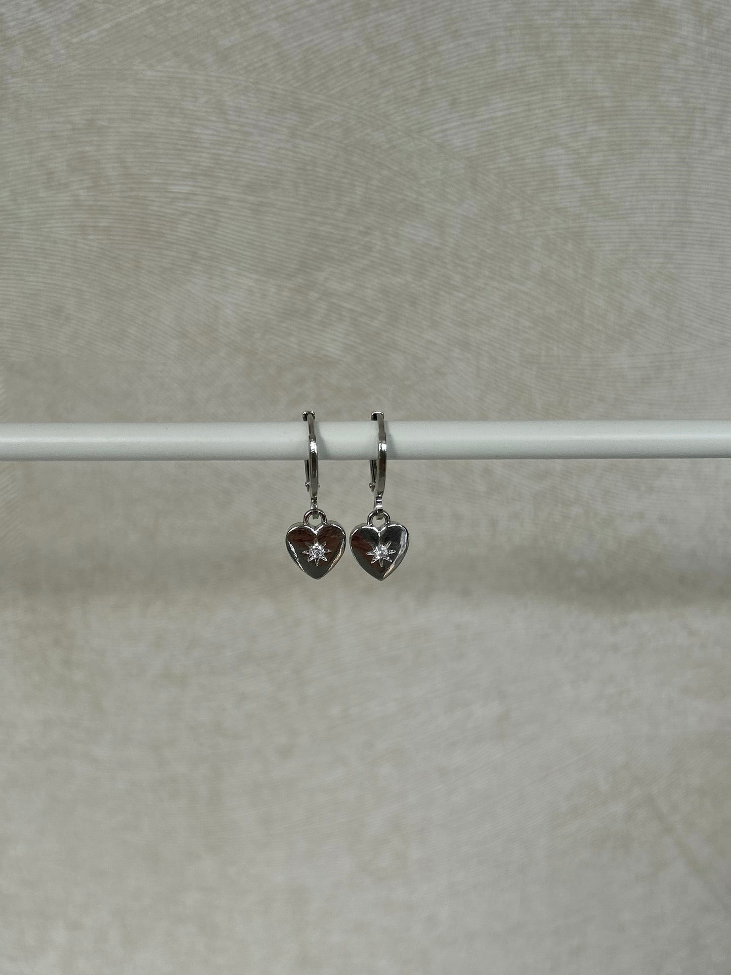STAR HEART HUGGIE EARRINGS IN PLATINUM