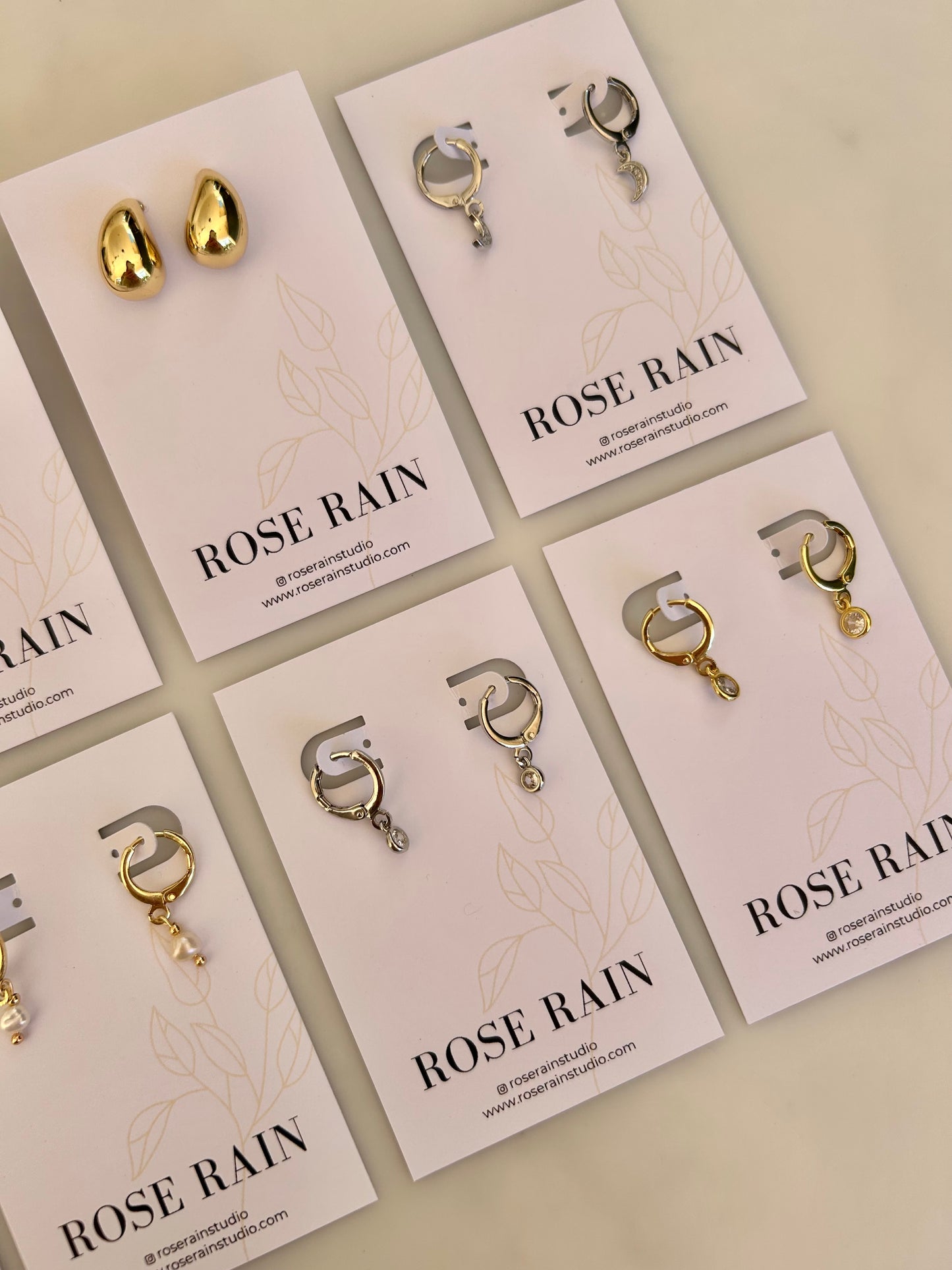 TINY DROP HUGGIE EARRINGS IN PLATINUM