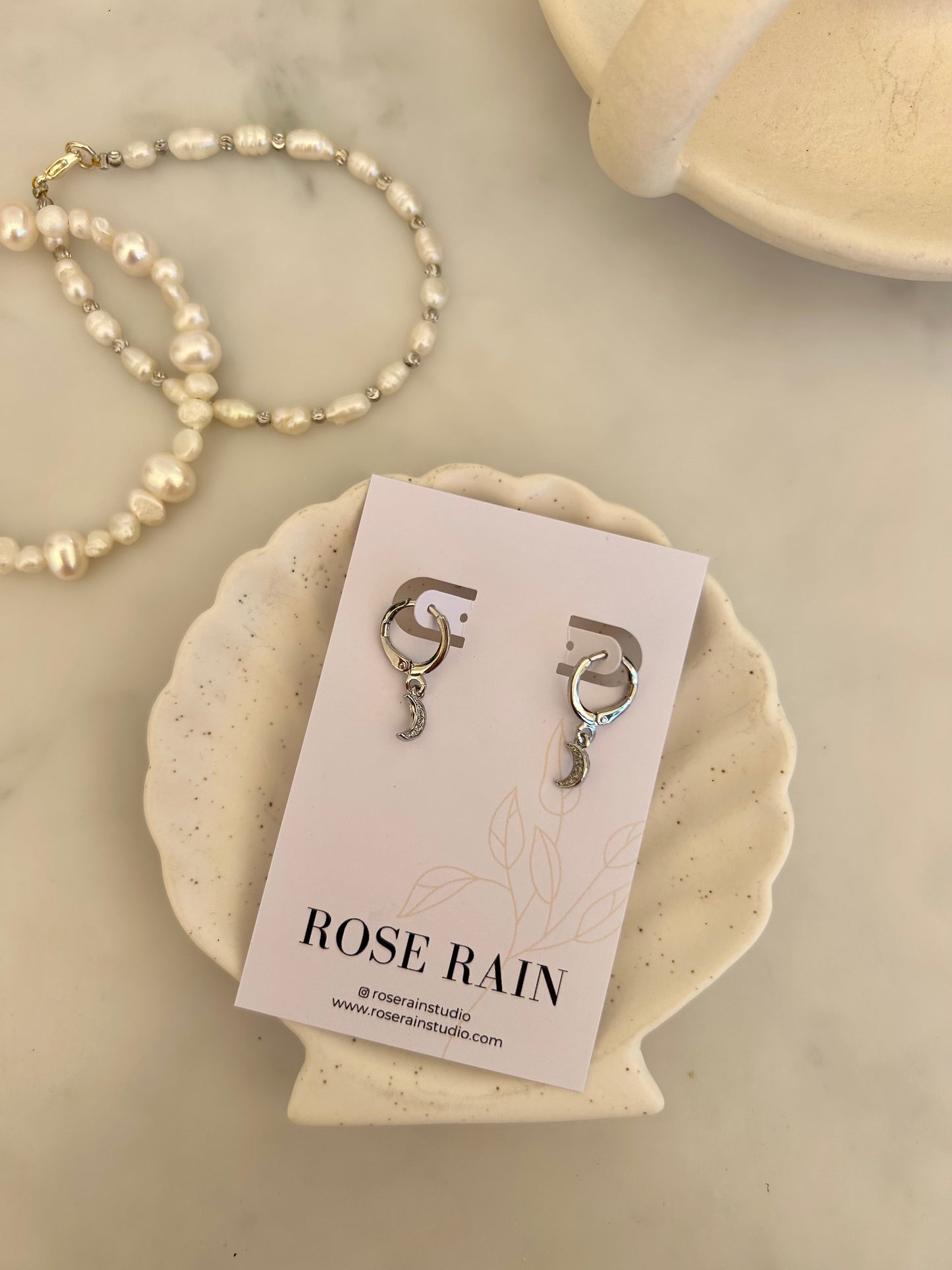 MOON HUGGIE EARRINGS IN PLATINUM