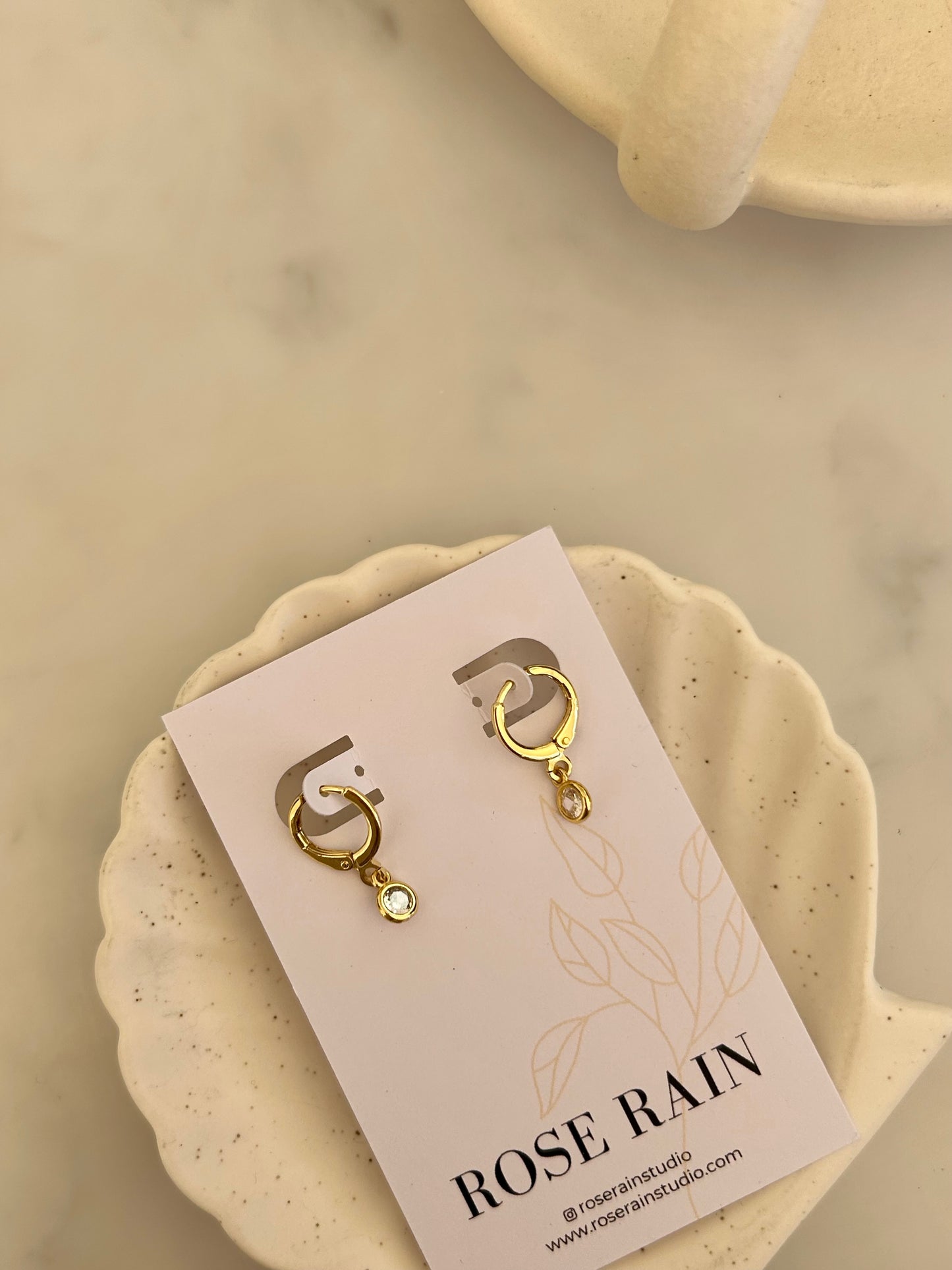 TINY DROP HUGGIE EARRINGS IN 18K GOLD