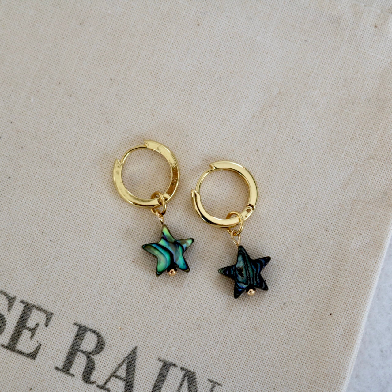 DETACHABLE BLACK SHELL STAR CHARM HUGGIE EARRINGS