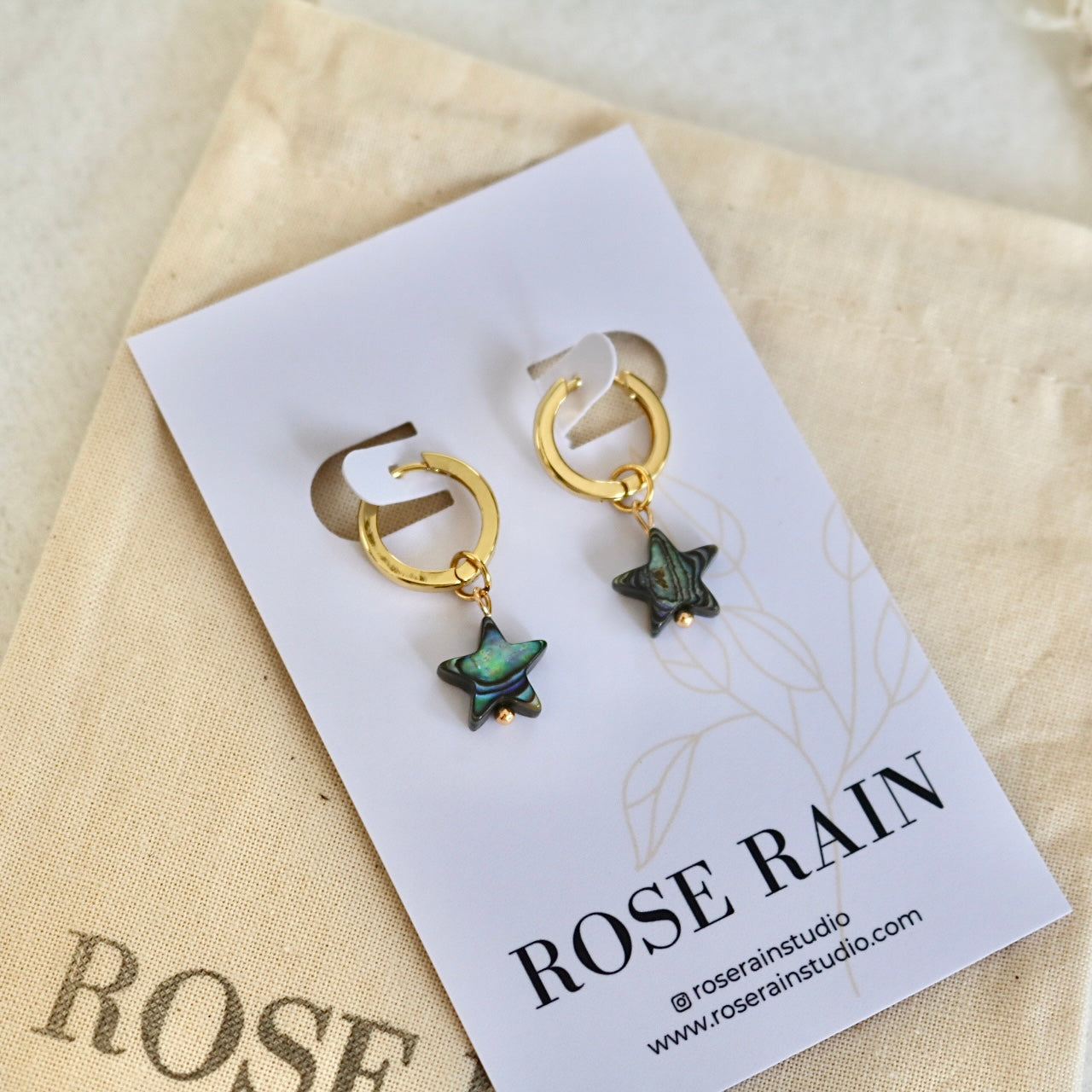 DETACHABLE BLACK SHELL STAR CHARM HUGGIE EARRINGS