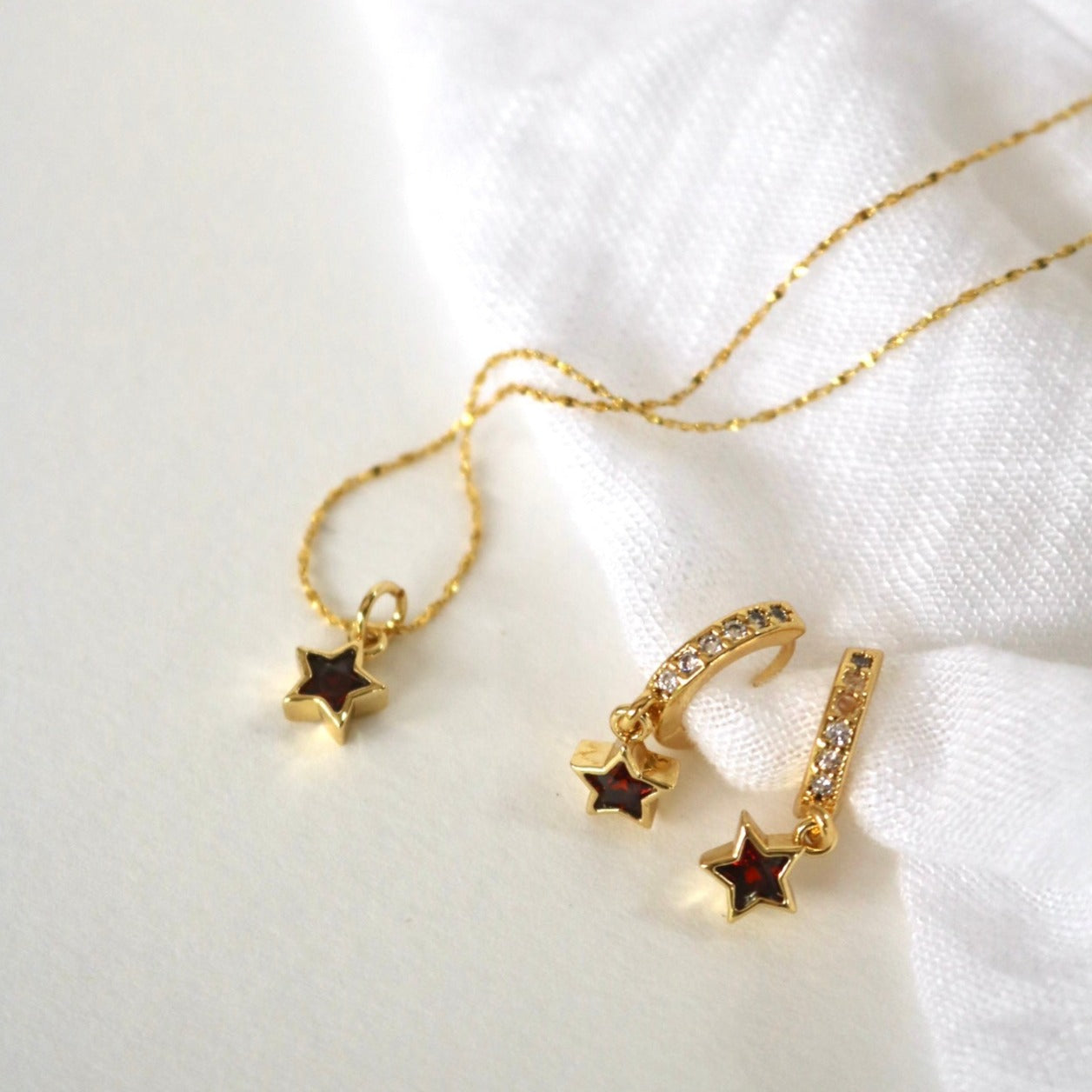RED STAR HUGGIE EARRINGS IN 18K GOLD