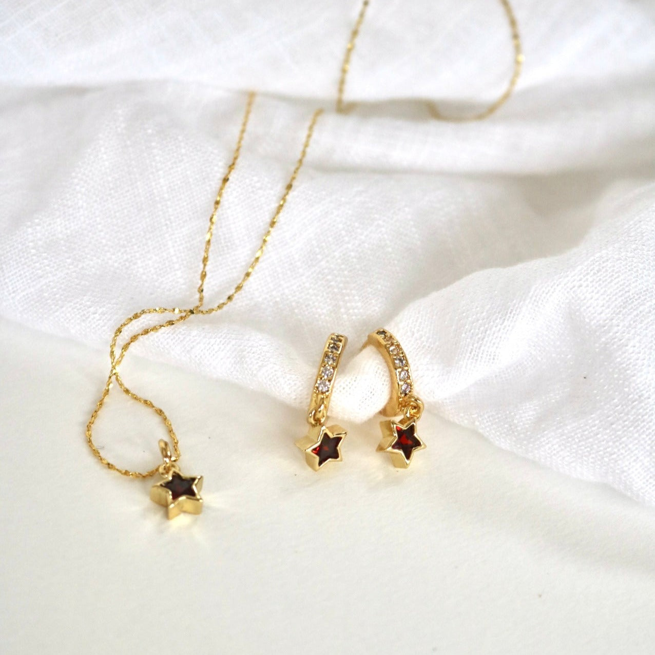 RED STAR HUGGIE EARRINGS IN 18K GOLD