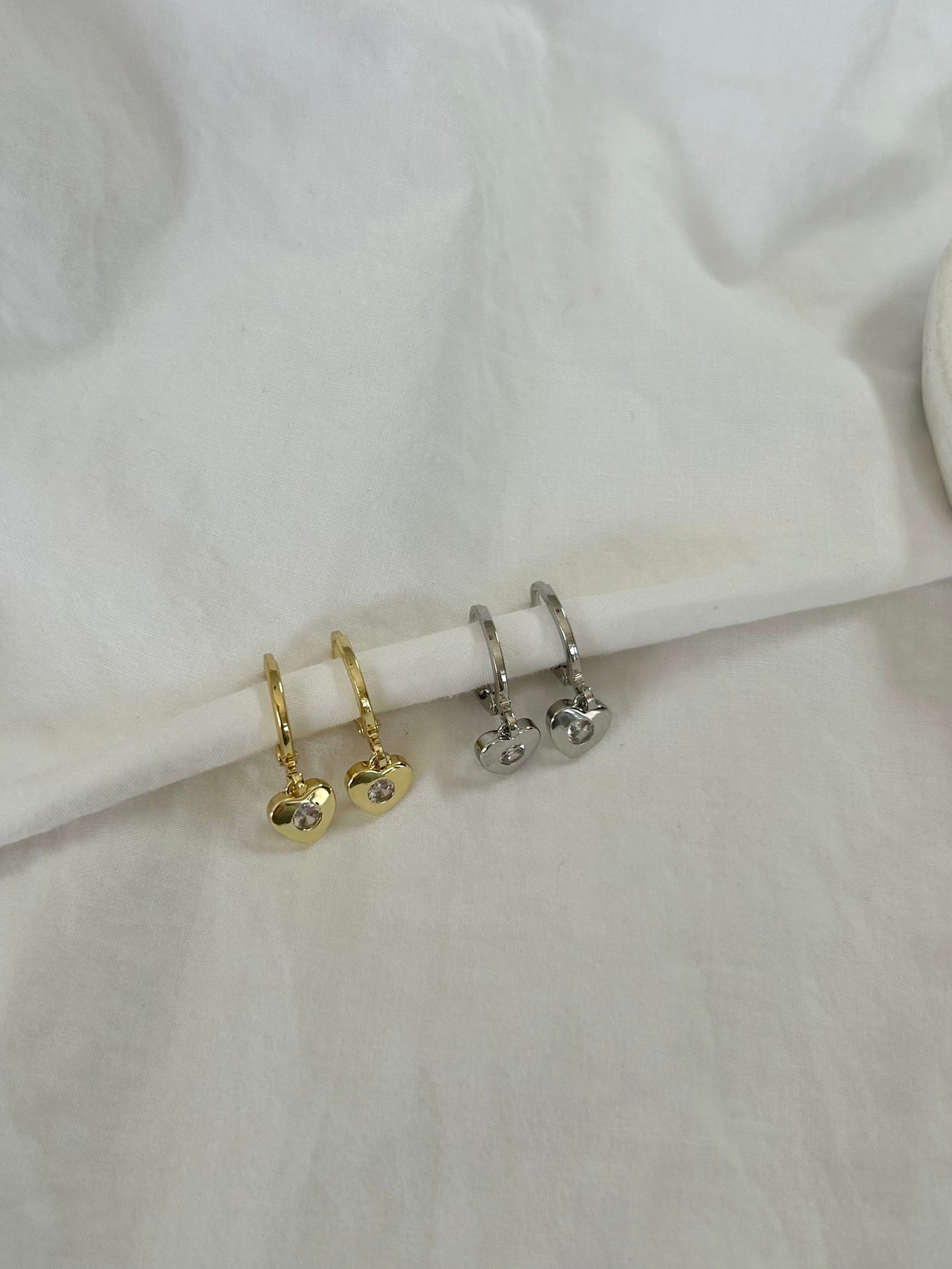 TINY HEART HUGGIE EARRINGS IN 18K GOLD