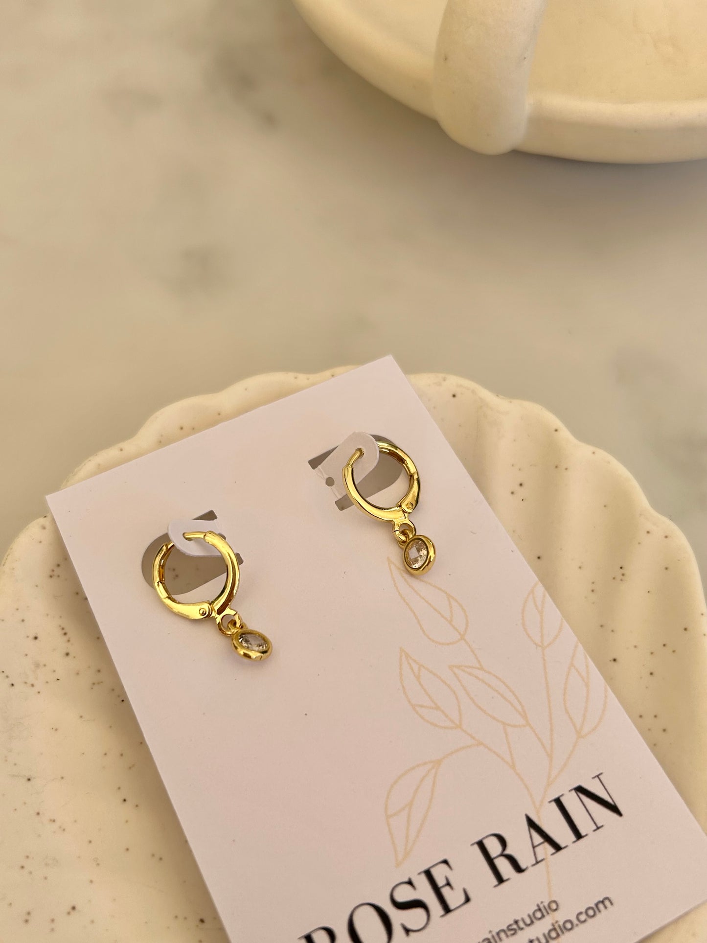 TINY DROP HUGGIE EARRINGS IN 18K GOLD