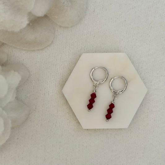 MILLIE RED HUGGIE EARRINGS IN PLATINUM