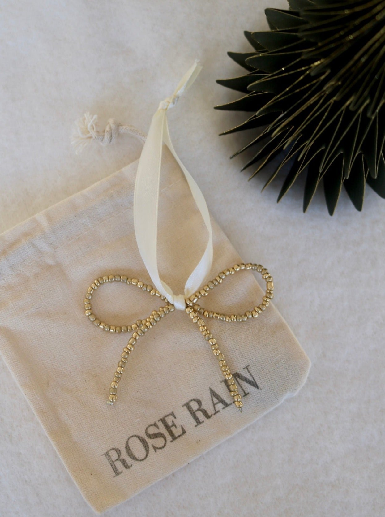 BOW DECORATION IN GOLD