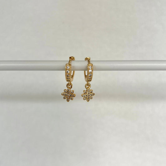 TINY SNOWFLAKE HUGGIE EARRINGS IN 18K GOLD