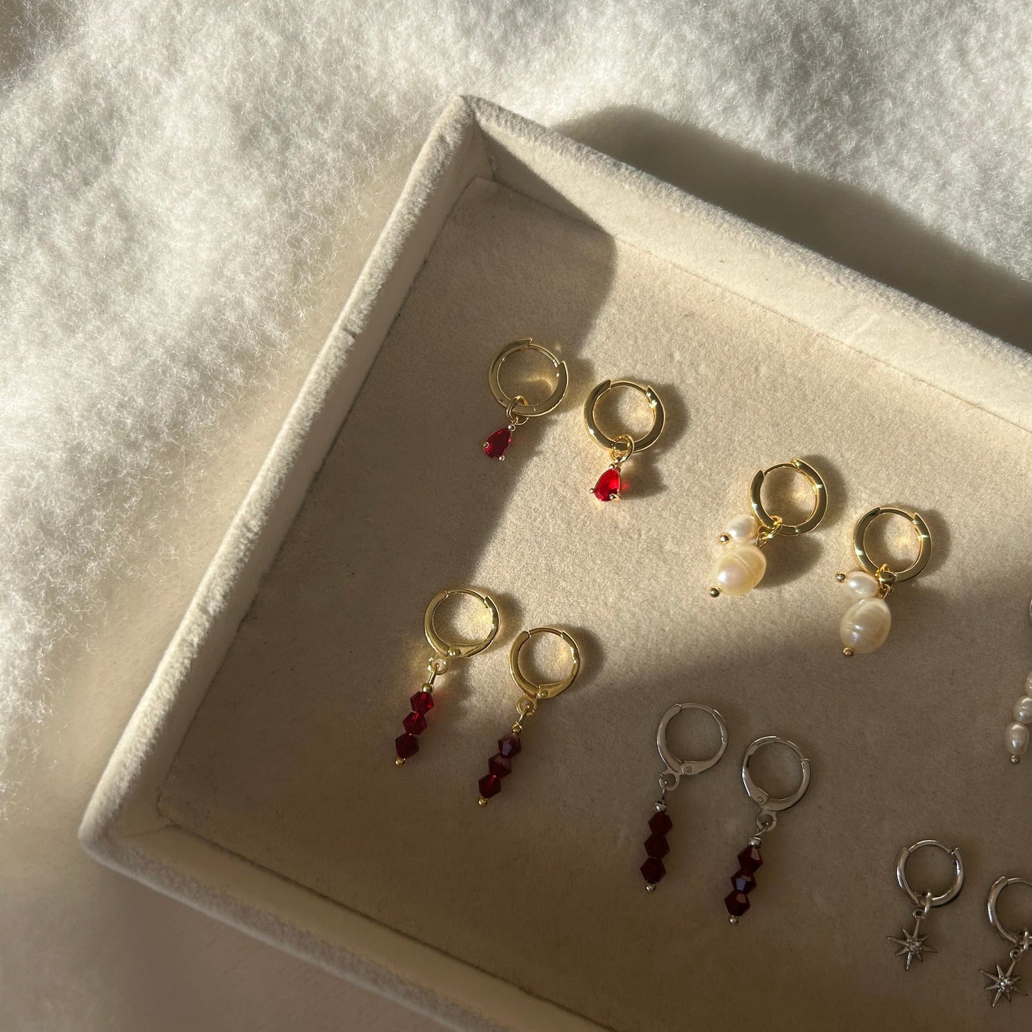 MILLIE RED HUGGIE EARRINGS IN PLATINUM