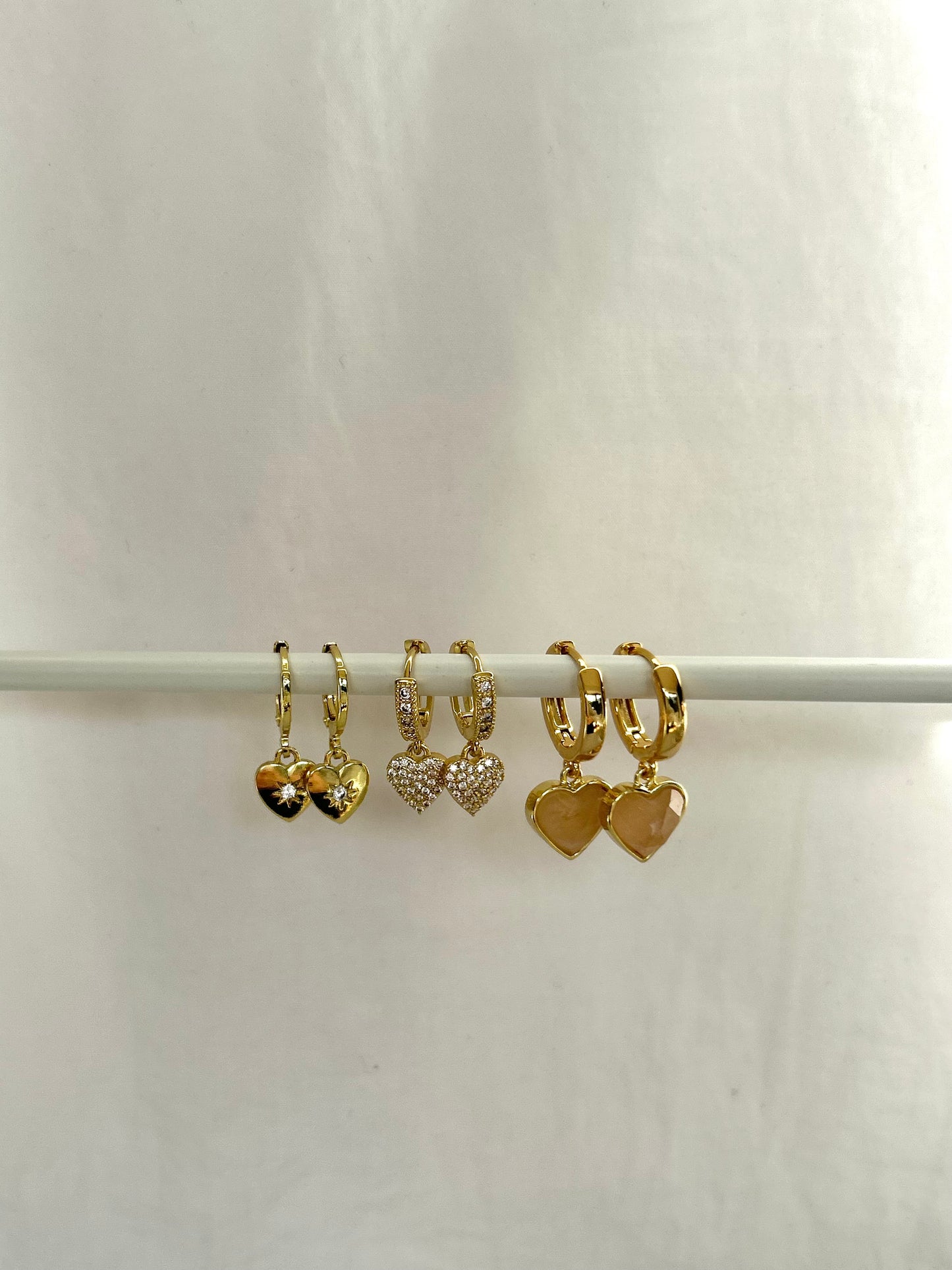 SPARKLE HEART HUGGIE EARRINGS IN 18K GOLD