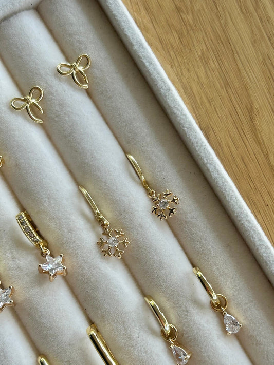 DAINTY SNOWFLAKE  HUGGIE EARRINGS IN 18K GOLD