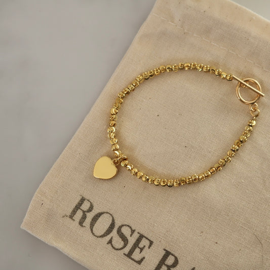 HEART CHARM BRACELET IN 18K GOLD