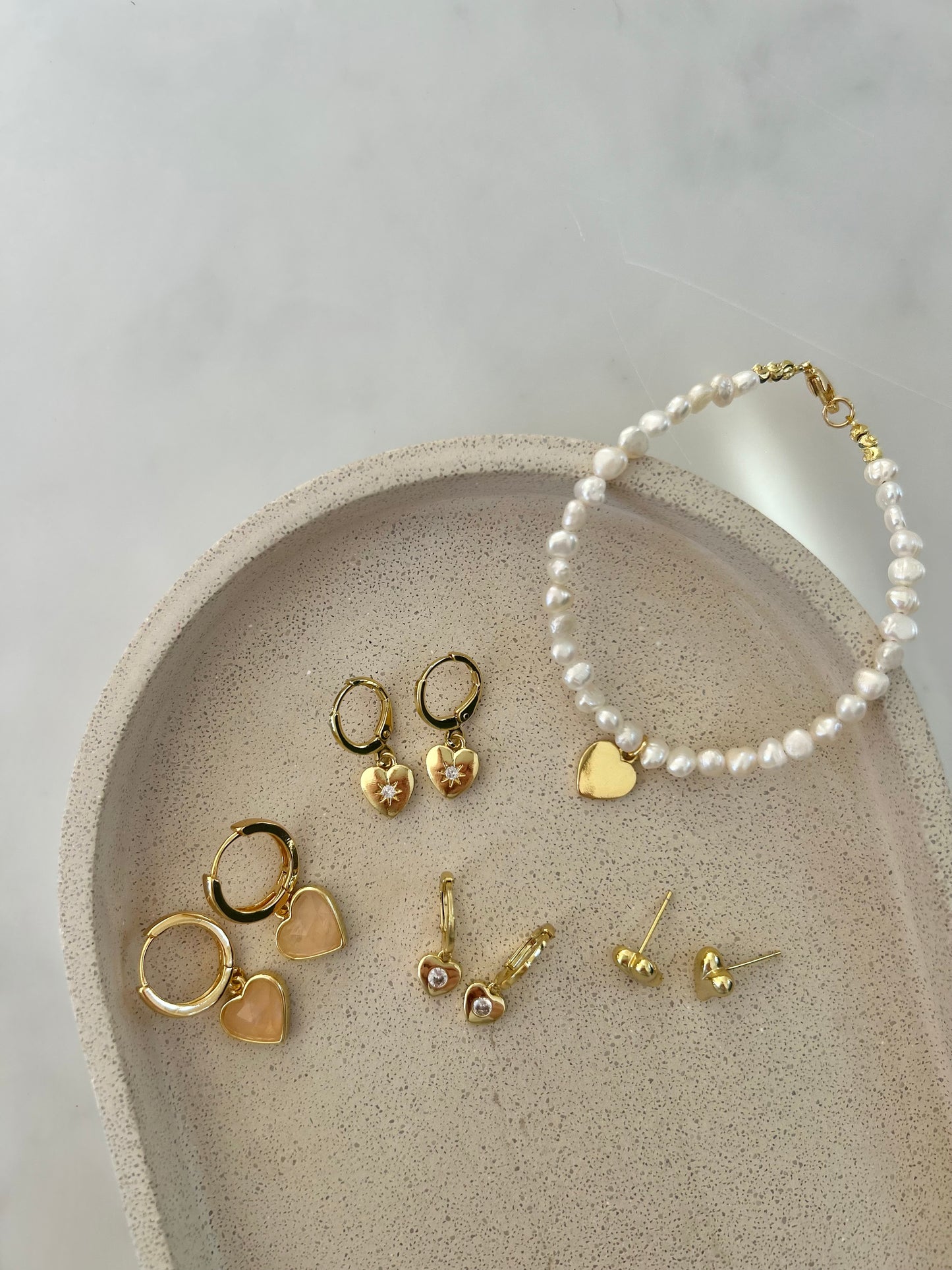 TINY HEART HUGGIE EARRINGS IN 18K GOLD