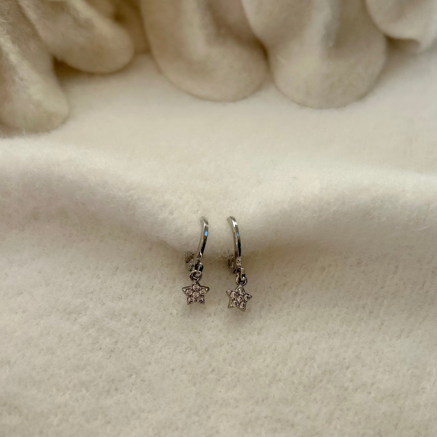 TINY STAR HUGGIE EARRINGS IN PLATINUM