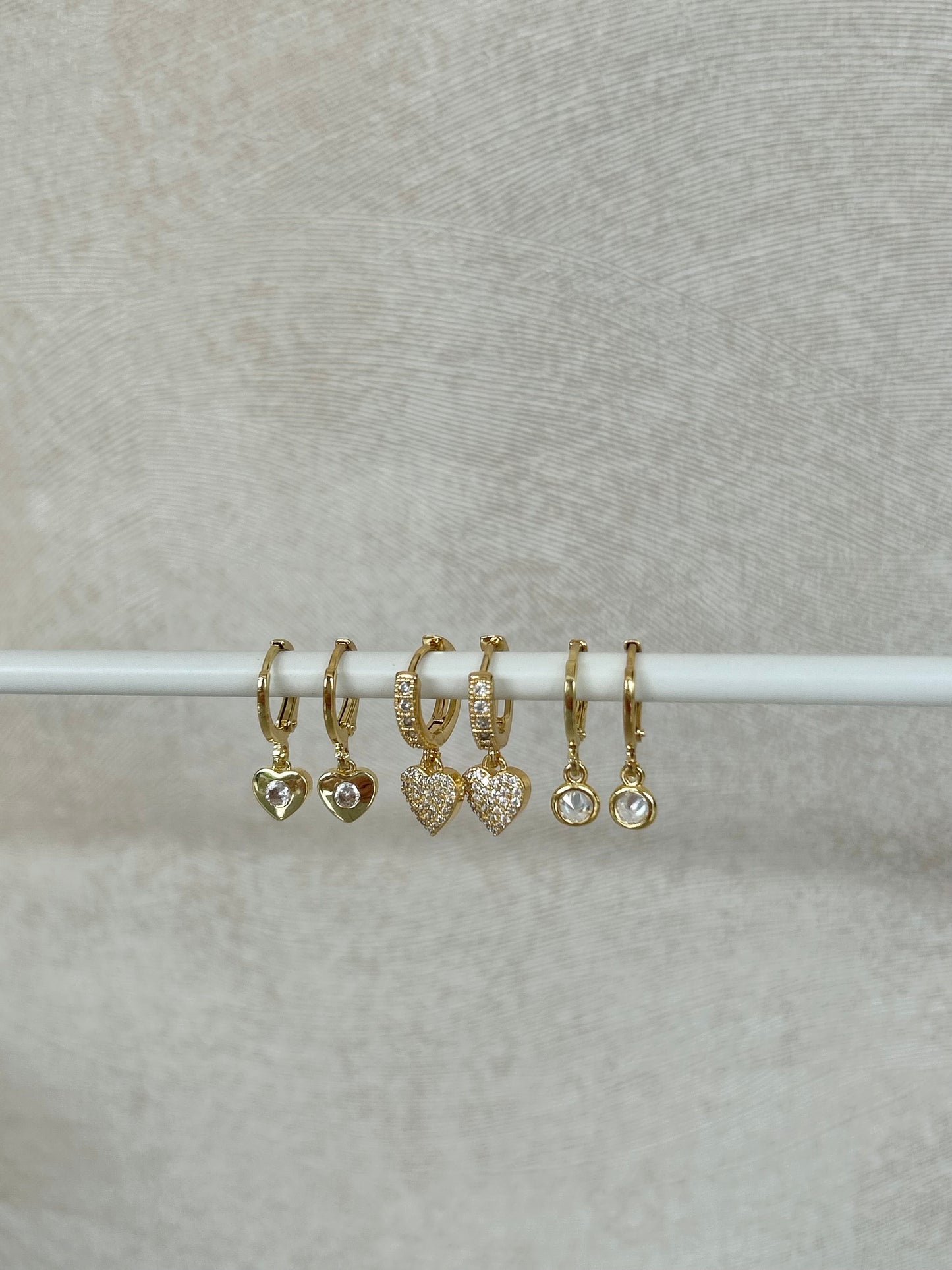 TINY HEART HUGGIE EARRINGS IN 18K GOLD