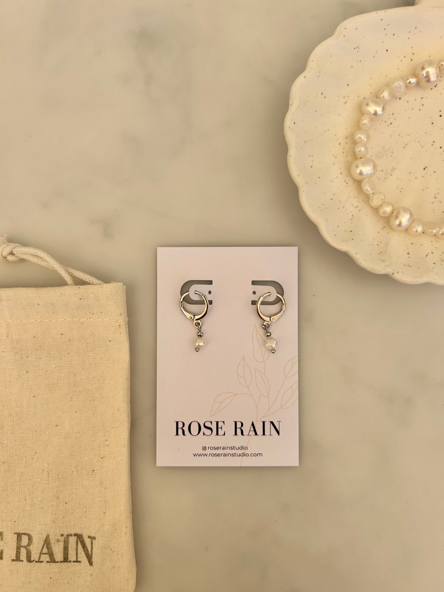 TINY FRESHWATER PEARL HUGGIE EARRINGS IN PLATINUM