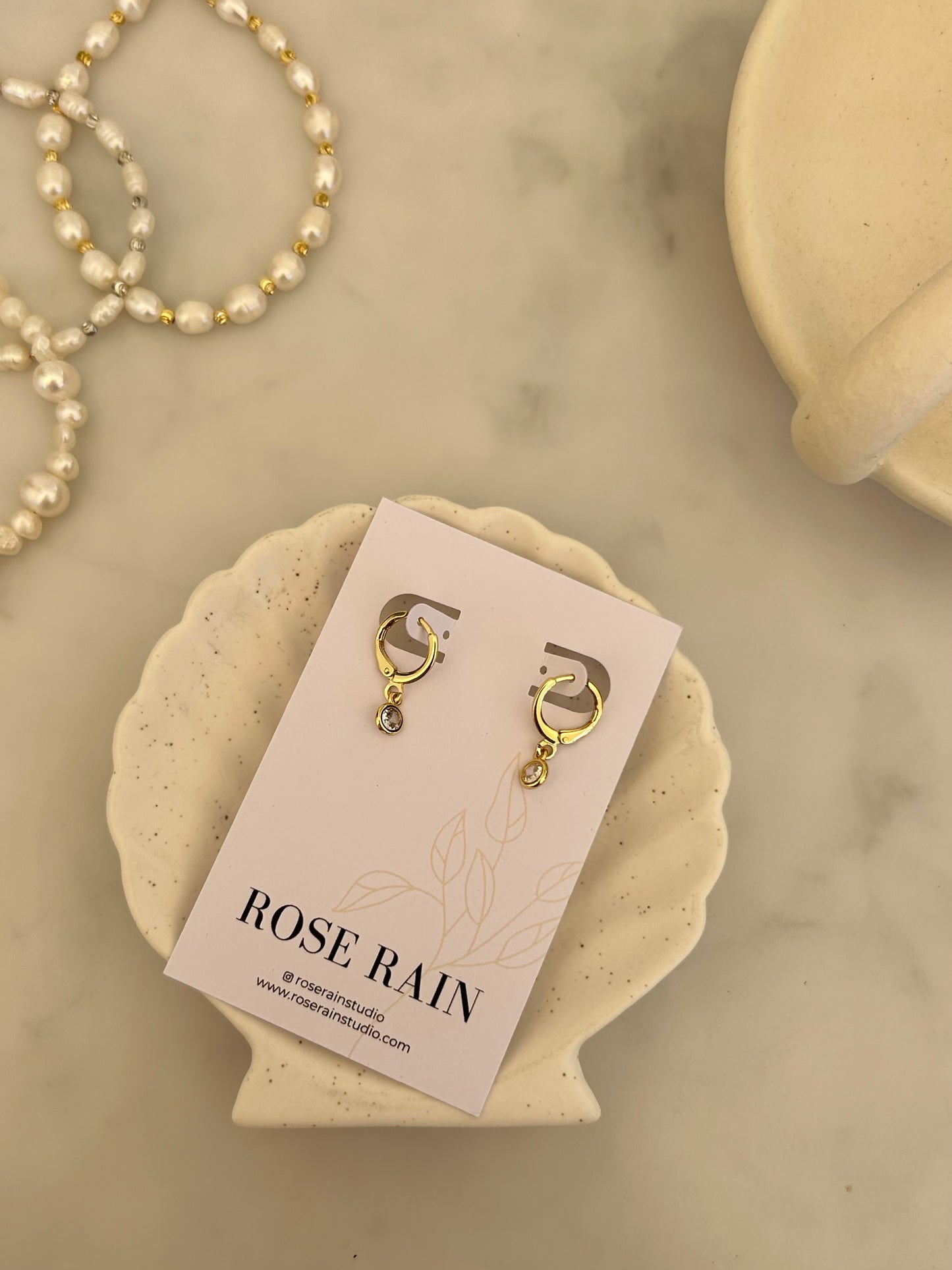 TINY DROP HUGGIE EARRINGS IN 18K GOLD