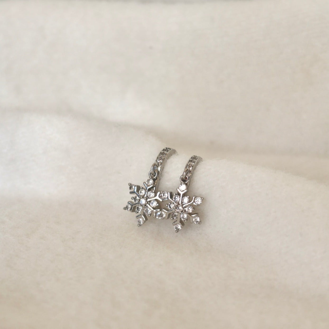 SNOWFLAKE HUGGIE EARRINGS IN PLATINUM