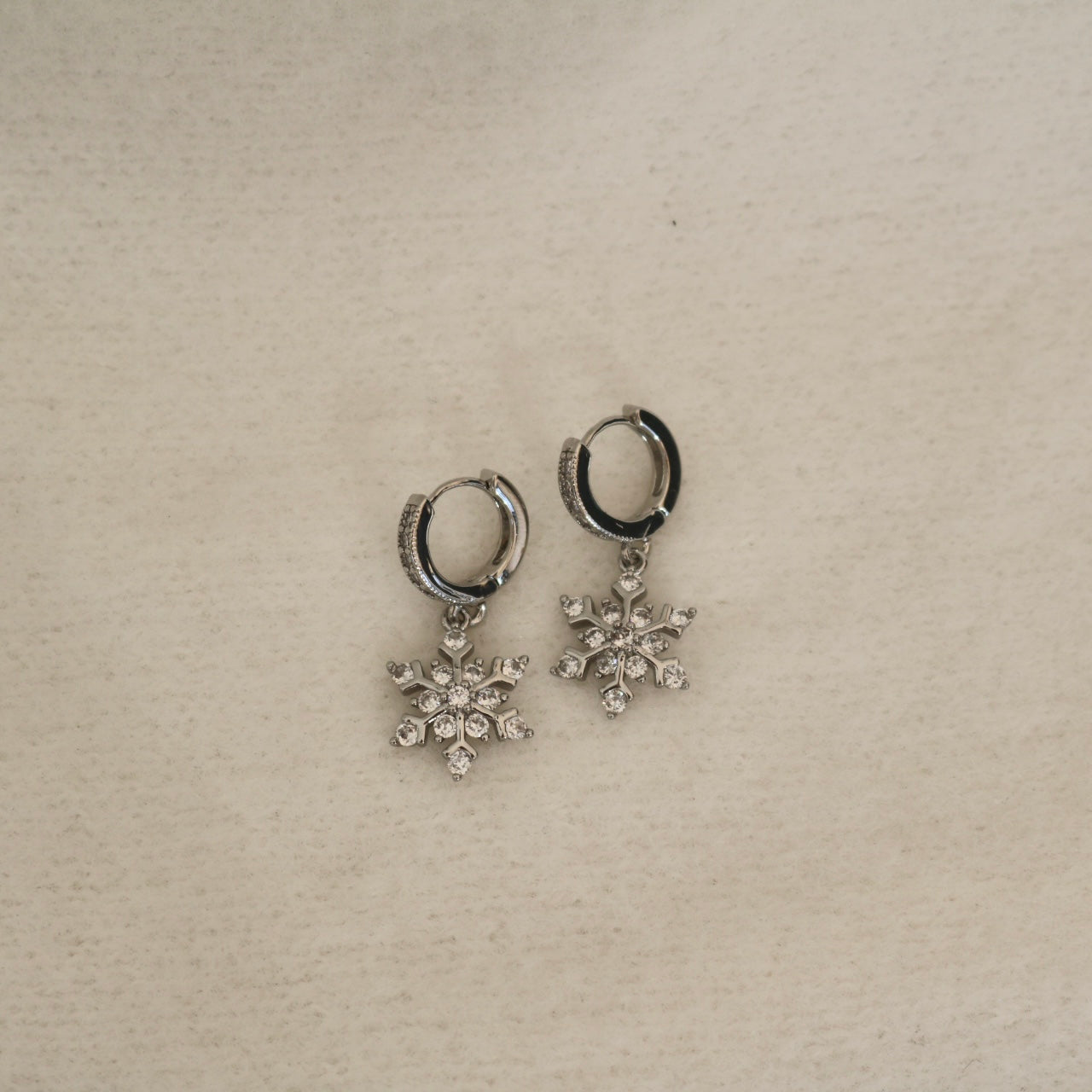 SNOWFLAKE HUGGIE EARRINGS IN PLATINUM