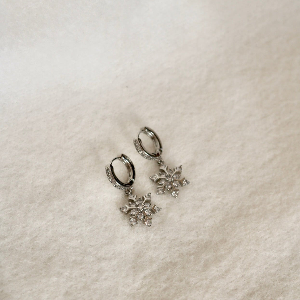 SNOWFLAKE HUGGIE EARRINGS IN PLATINUM