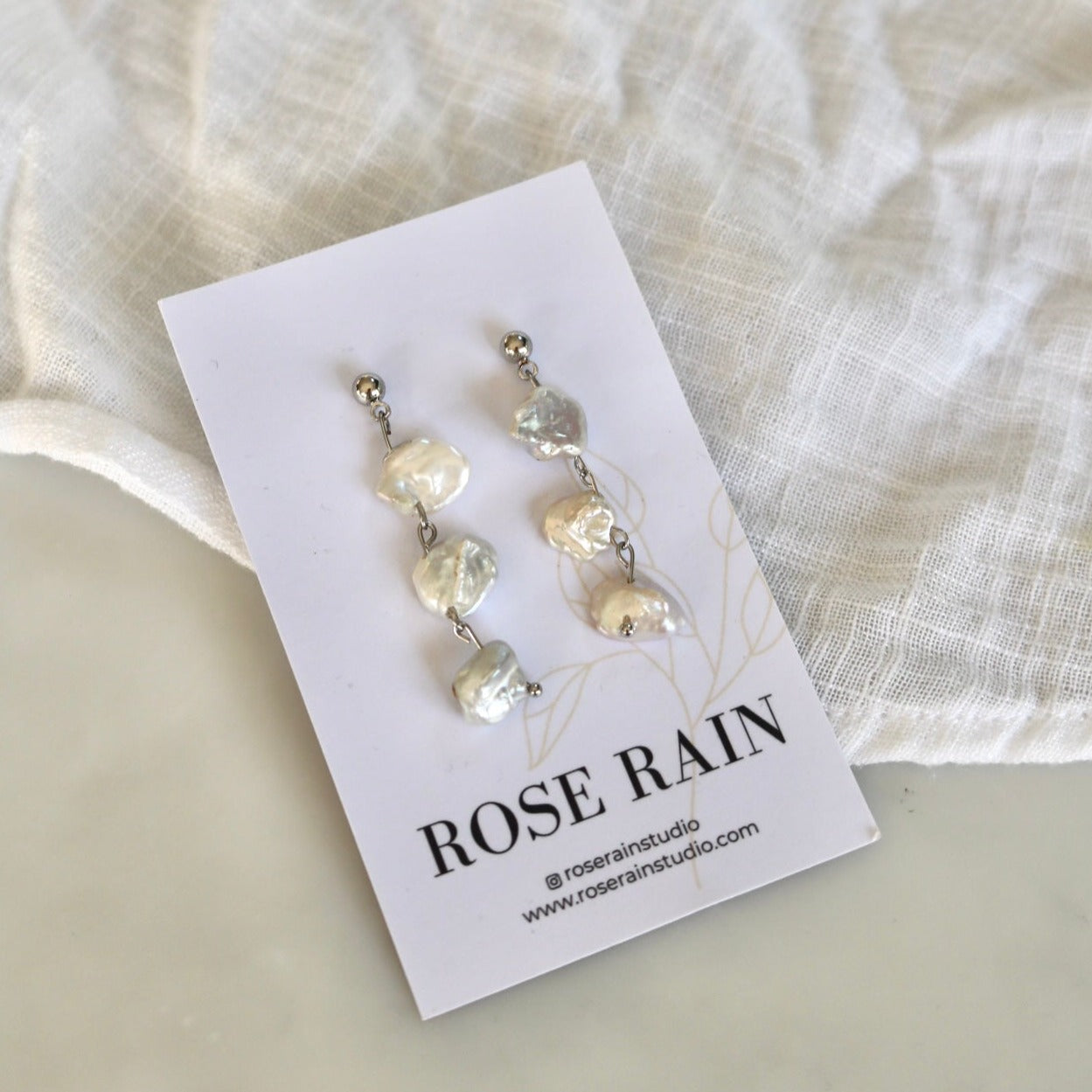 ARIEL DANGLE PEARL STUDS IN PLATINUM