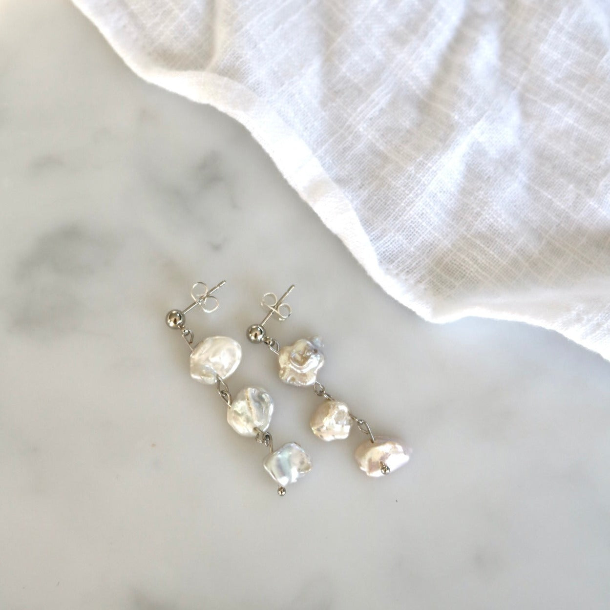 ARIEL DANGLE PEARL STUDS IN PLATINUM