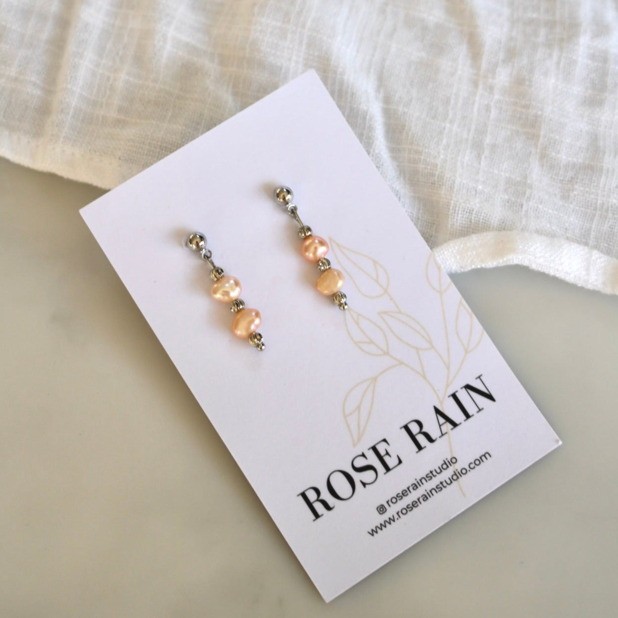 SUNRISE PINK FRESHWATER PEARL STUDS IN PLATINUM