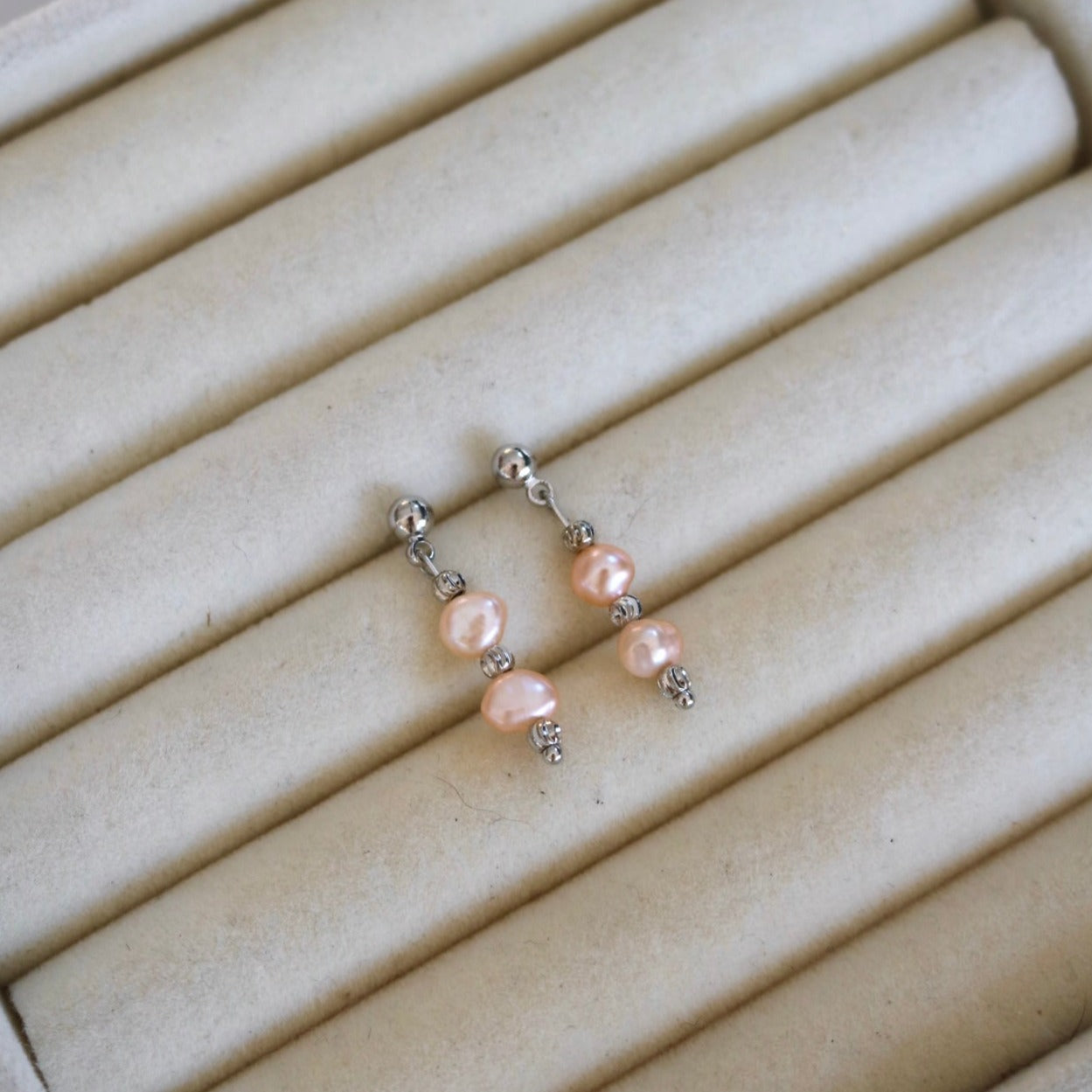 SUNRISE PINK FRESHWATER PEARL STUDS IN PLATINUM