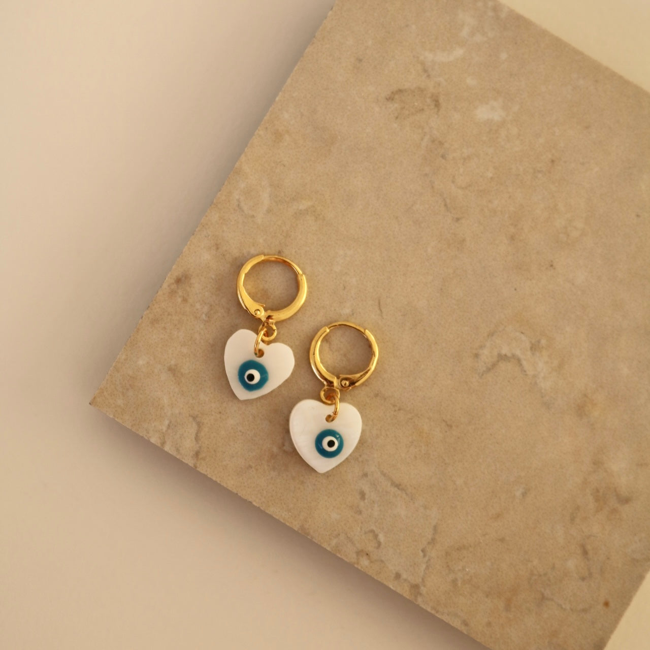 EVIL EYE HEART FRESHWATER SHELL HUGGIE EARRINGS IN 18K GOLD