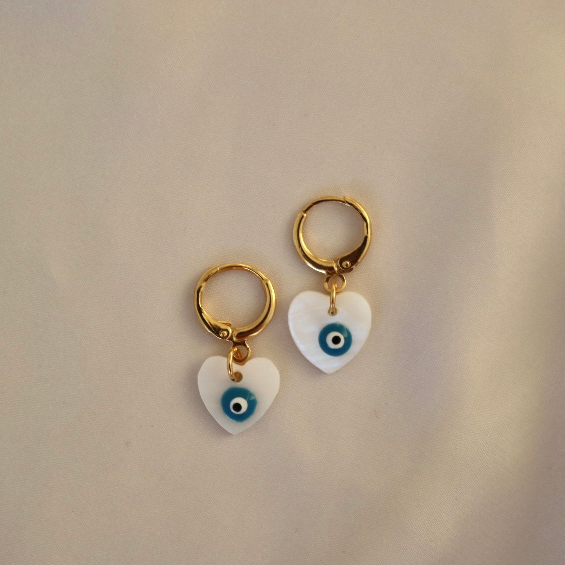 EVIL EYE HEART FRESHWATER SHELL HUGGIE EARRINGS IN 18K GOLD