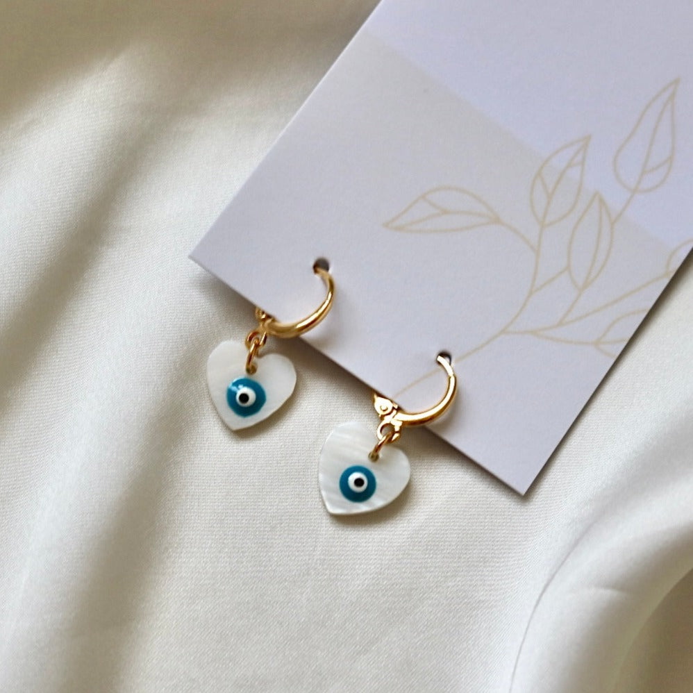 EVIL EYE HEART FRESHWATER SHELL HUGGIE EARRINGS IN 18K GOLD