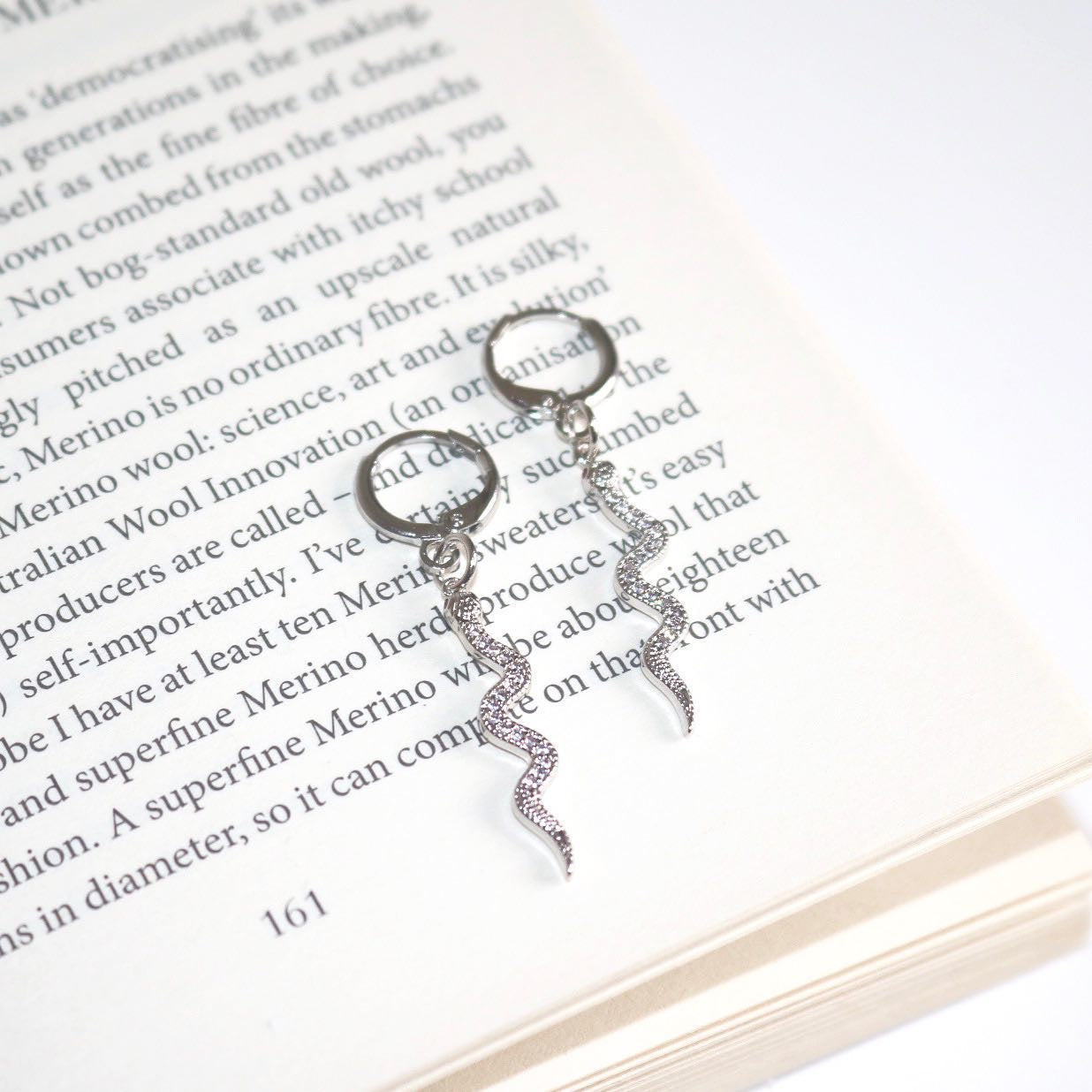 SNAKE CHARM HUGGIE EARRINGS IN PLATINUM